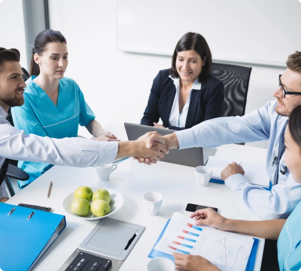 Business meeting with handshake and discussion