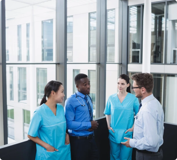 Medical professionals discussing in office